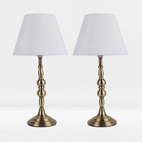 First Choice Lighting - Set of 2 Antique Brass Plated Bedside Table Light with Candle Column White Fabric Shade - Antique brass plate and textured